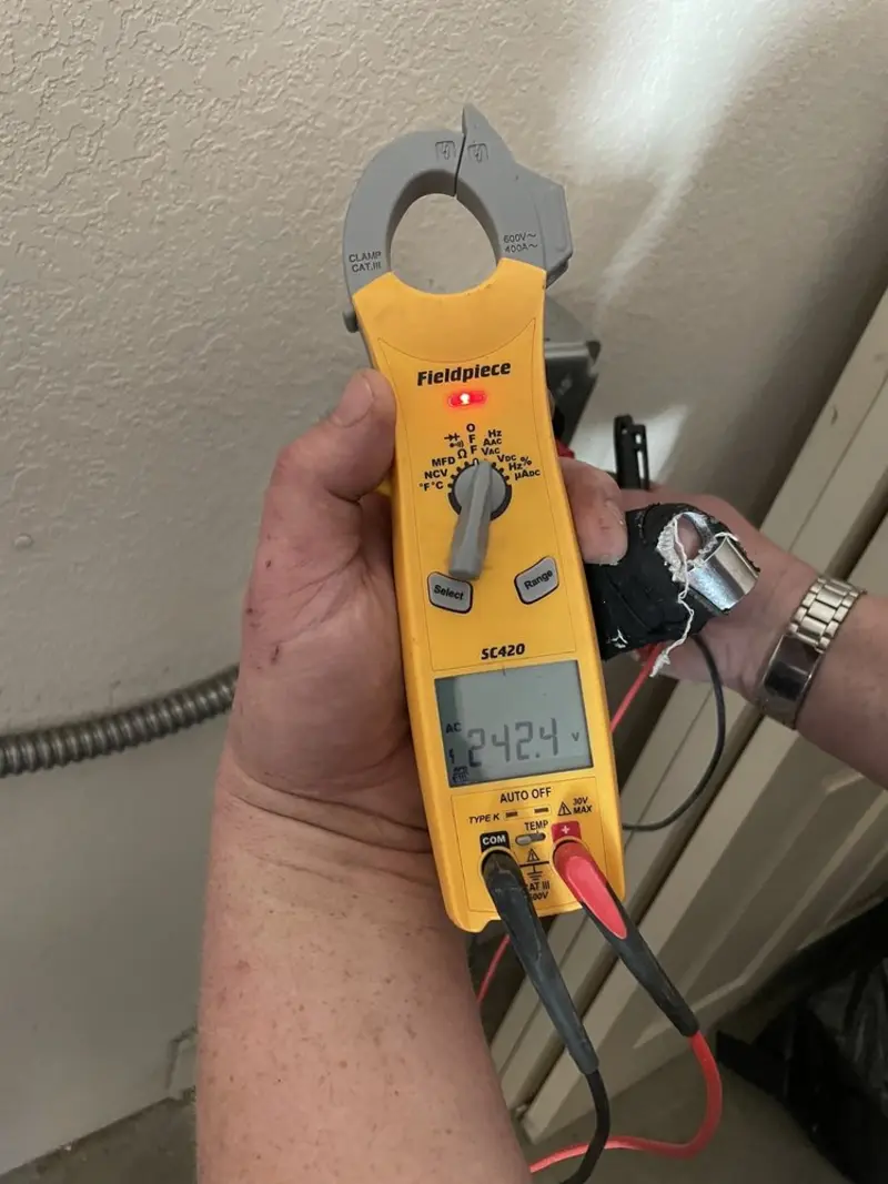 Voltage testing with clamp meter during Electrical Installation Services in Winter Gardens